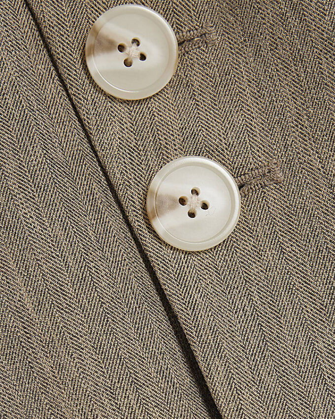 Beige asymmetrisk väst med bälte