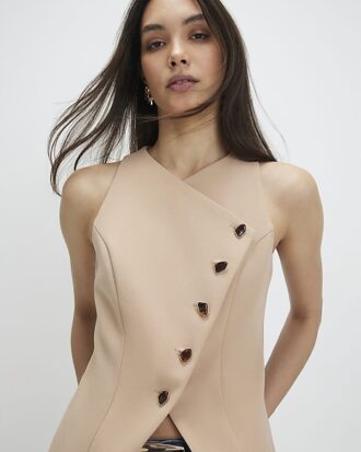 Beige asymmetrisk väst utan krage
