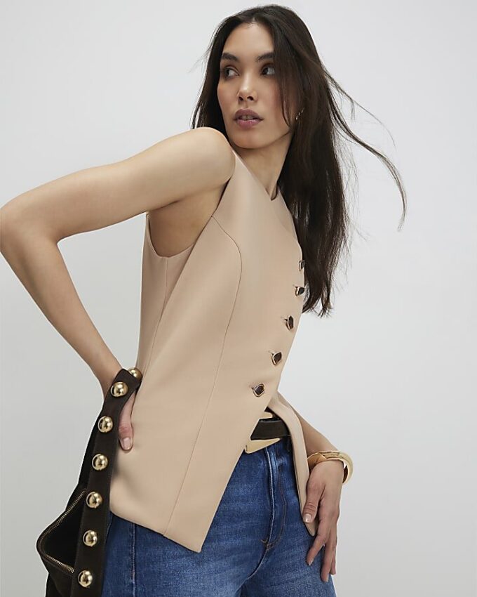 Beige asymmetrisk väst utan krage