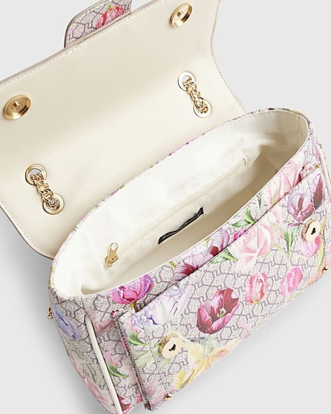Beige axelväska med blommigt monogramtryck
