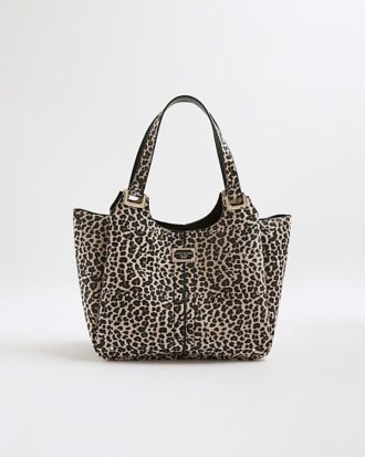 Beige axelväska med leopardmönster och vingar