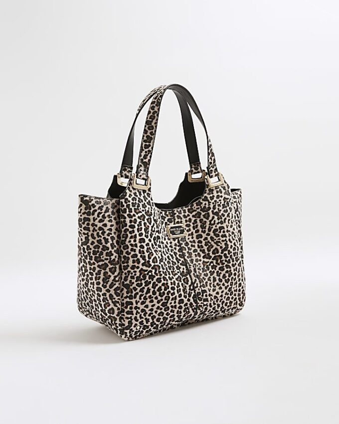 Beige axelväska med leopardmönster och vingar