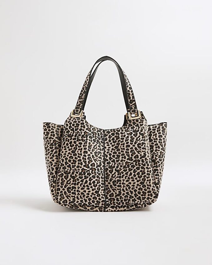 Beige axelväska med leopardmönster och vingar
