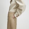 Beige byxor i barrel-modell i konstläder
