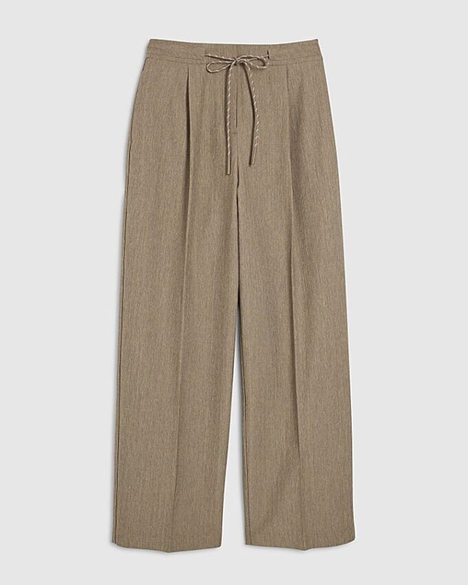Beige byxor med knytdetalj