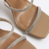 Beige diamantprydda mules med dubbla remmar och klack