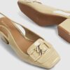 Beige loafers med spänne och slingback-klack