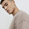Beige oversized-passformad T-shirt