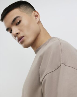Beige oversized-passformad T-shirt
