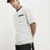Beige oversized-passformad T-shirt med randig ficka