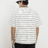 Beige oversized-passformad T-shirt med randig ficka
