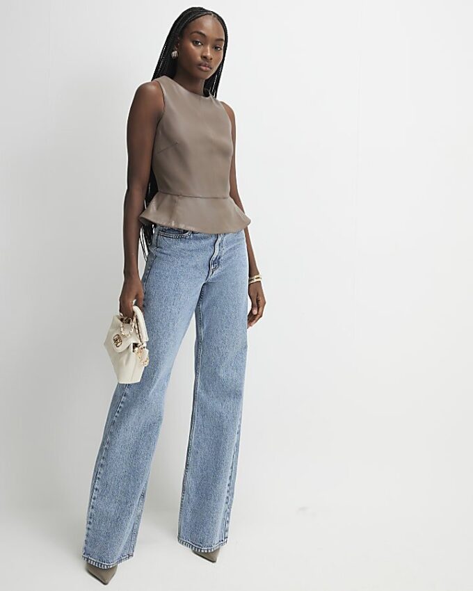 Beige peplumtop i imitationsläder