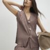 Beige plisserad väst