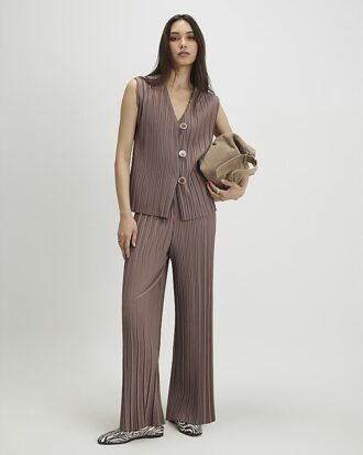 Beige plisserade byxor med vida ben