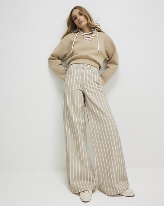 Beige randiga jeans med vida ben