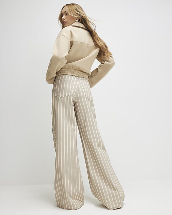 Beige randiga jeans med vida ben