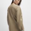 Beige skulpterad blazer i konstläder