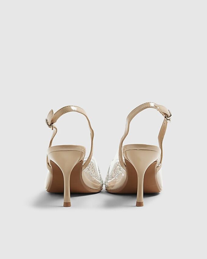 Beige spetsiga pumps med klack i plexiglas