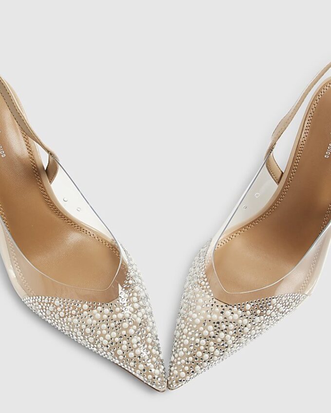 Beige spetsiga pumps med klack i plexiglas