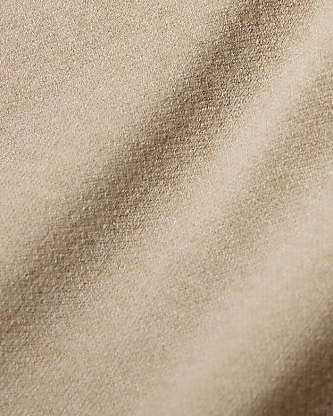 Beige stickade byxor med vida ben