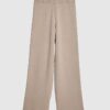 Beige stickade byxor med vida ben