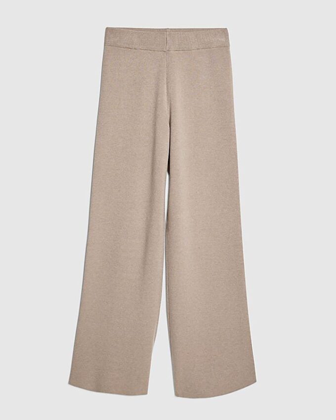 Beige stickade byxor med vida ben