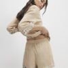 Beige strandshorts med paljetter