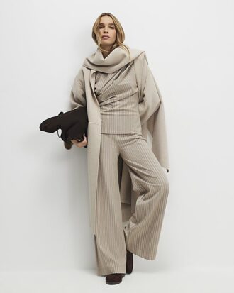Beige stretchiga randiga byxor med vida ben