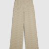 Beige stretchiga randiga byxor med vida ben