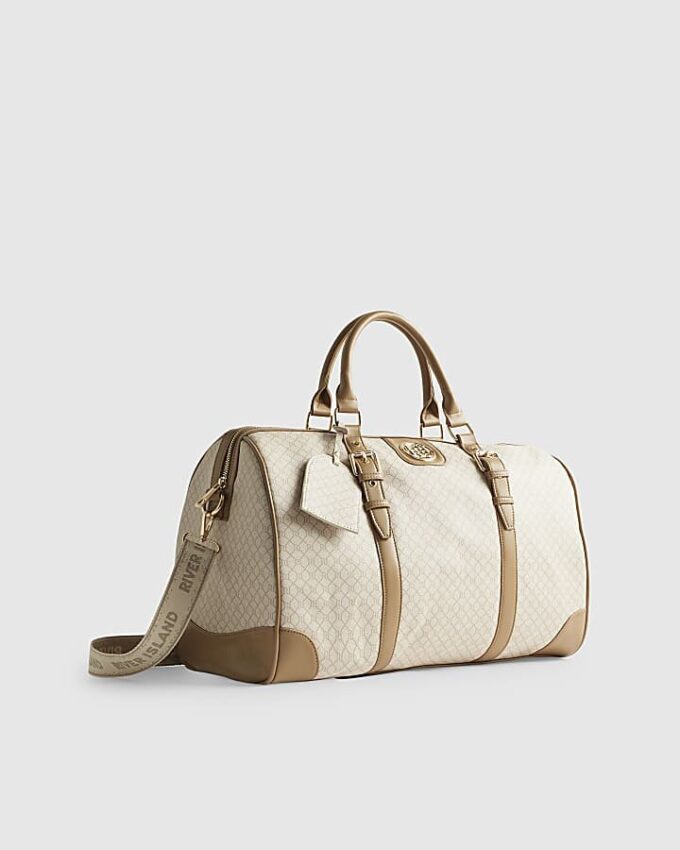 Beige väska med spänne och monogram