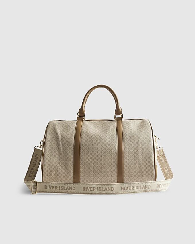 Beige väska med spänne och monogram