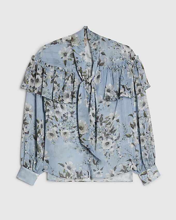 Blå blus med blommönster och volangkrage