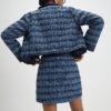 Blå bouclé-minikjol med scallopkant Blå bouclé-minikjol med scallopkant