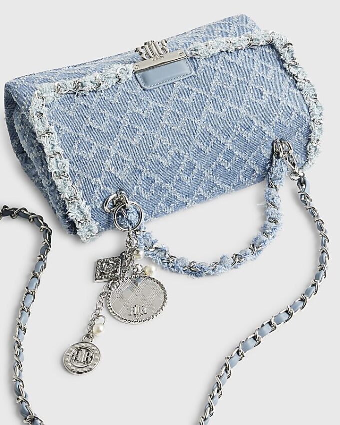 Blå denim axelväska med flik fram