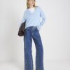 Blå jeans med hög midja, sömmar och vida ben