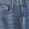Blå jeans med medelhög midja och barellben