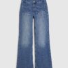 Blå knappdetaljer på fickorna Framåtvidgade jeans