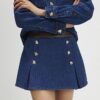 Blå miniskort i denim och plisserat konstläder Blå miniskort i denim och plisserat konstläder