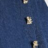 Blå miniskort i denim och plisserat konstläder Blå miniskort i denim och plisserat konstläder