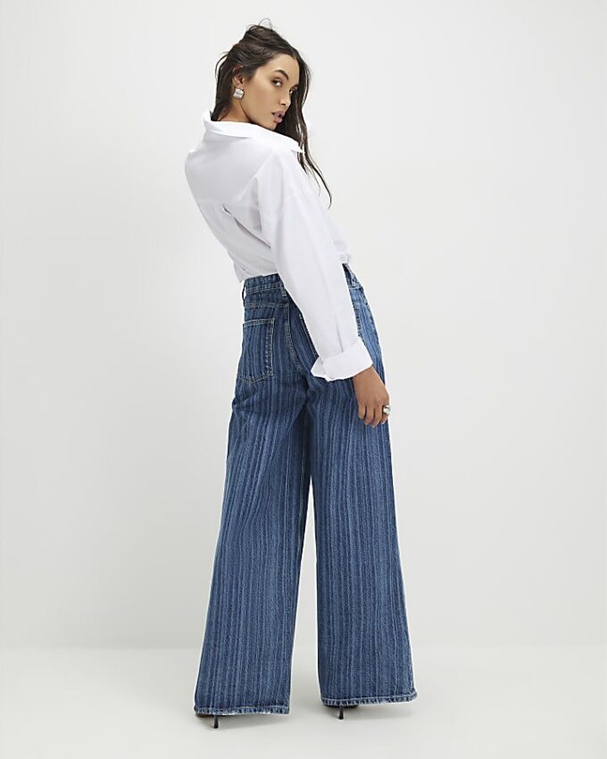 Blå randiga jeans med vida ben Blå randiga jeans med vida ben