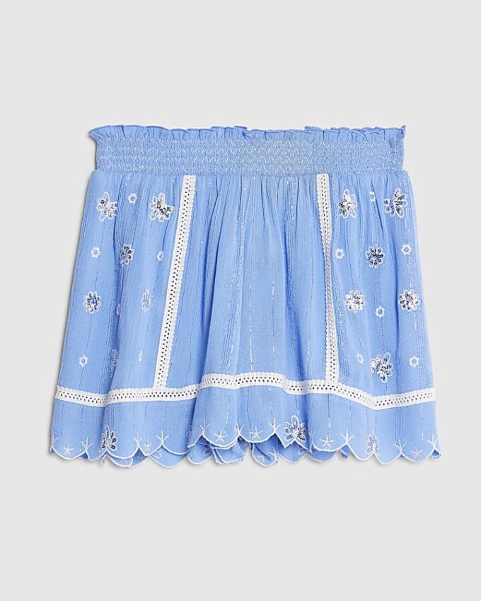 Blå strandshorts med broderad spets