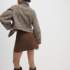 Brun minikjol i imitationsmocka