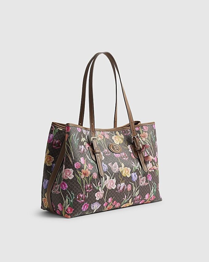 Brun shopperväska med blommigt monogram och spänne
