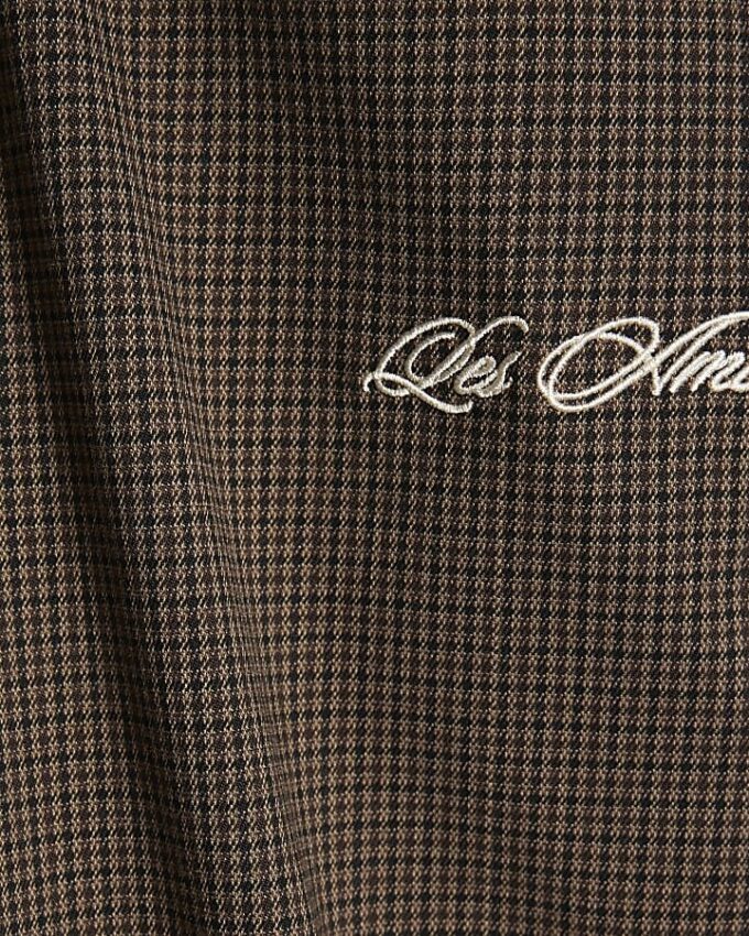 Bruna slim fit-byxor med hundtandsmönster och piping