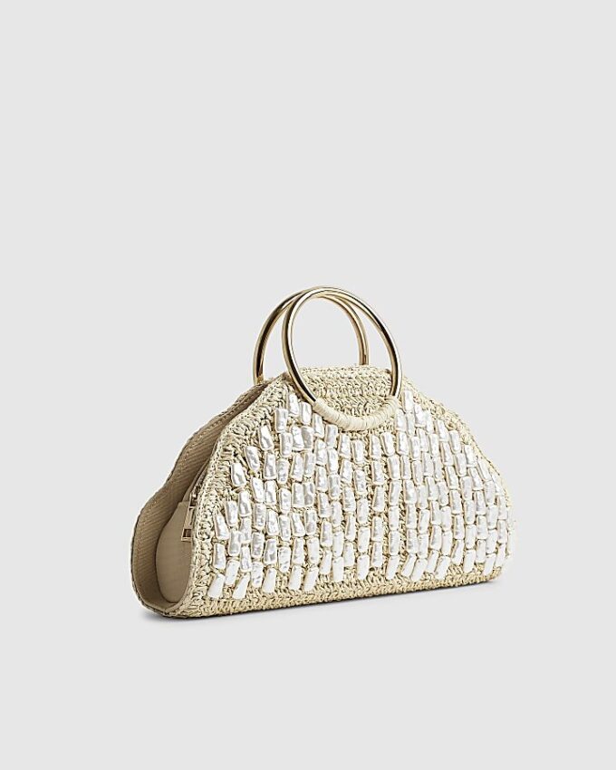 Creamfärgad handväska med pärlhandtag i raffia