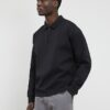 Grå Luminis-polotröja i oversized-modell Grå Luminis-polotröja i oversized-modell