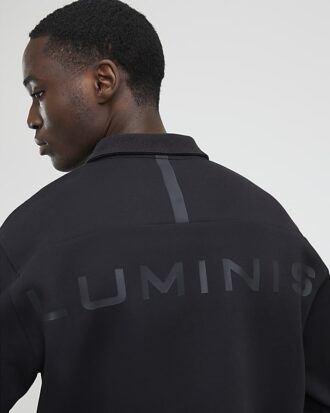 Grå Luminis-polotröja i oversized-modell