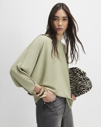Grön långärmad batwing-top