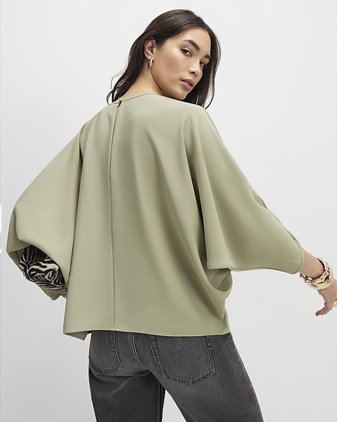 Grön långärmad batwing-top