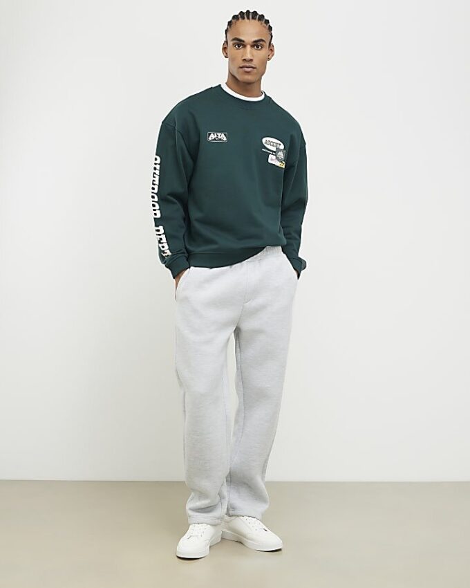 Grön oversized-tröja med alpinbadge
